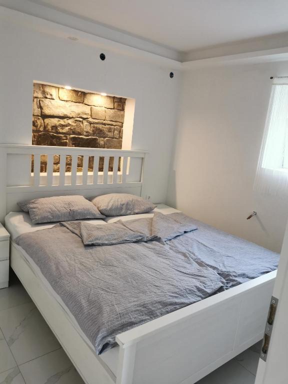 Postel nebo postele na pokoji v ubytování APARTMA KANTINA