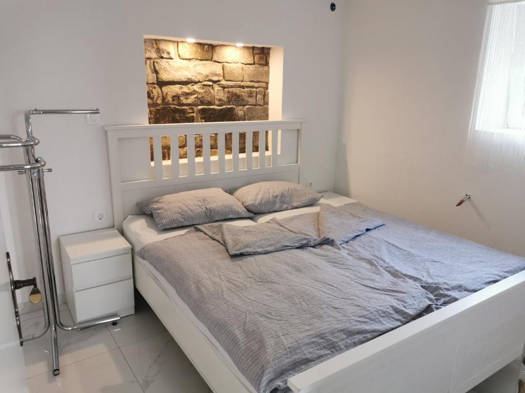 Postel nebo postele na pokoji v ubytování APARTMA KANTINA