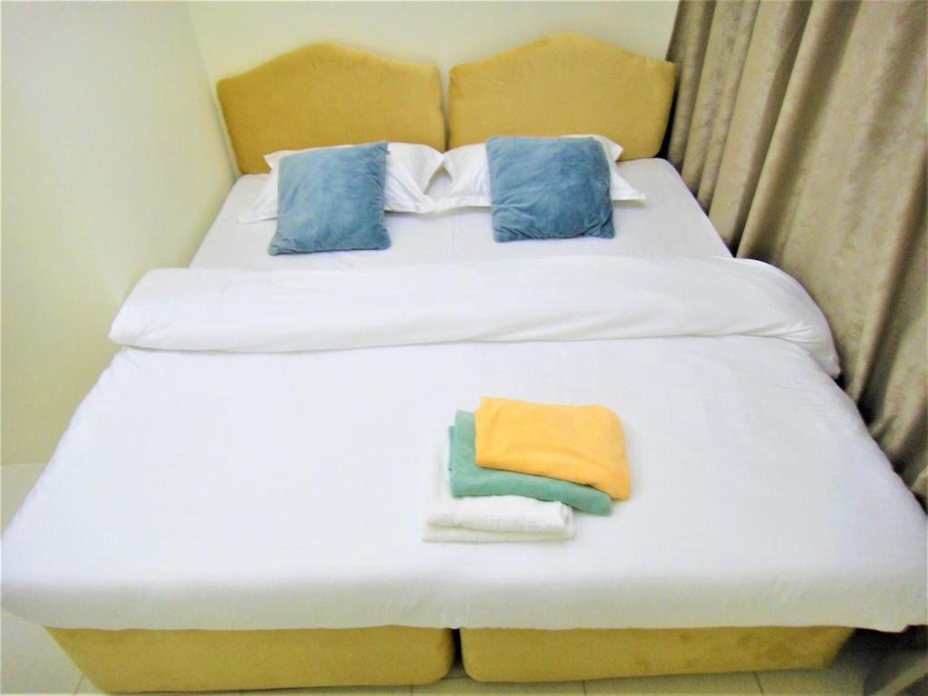 Postel nebo postele na pokoji v ubytování Abu Hail Star Residence - Home Stay