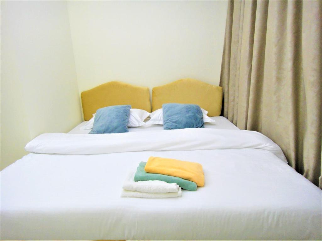 Postel nebo postele na pokoji v ubytování Abu Hail Star Residence - Home Stay