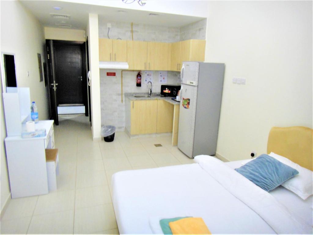 Kuchyň nebo kuchyňský kout v ubytování Abu Hail Star Residence - Home Stay
