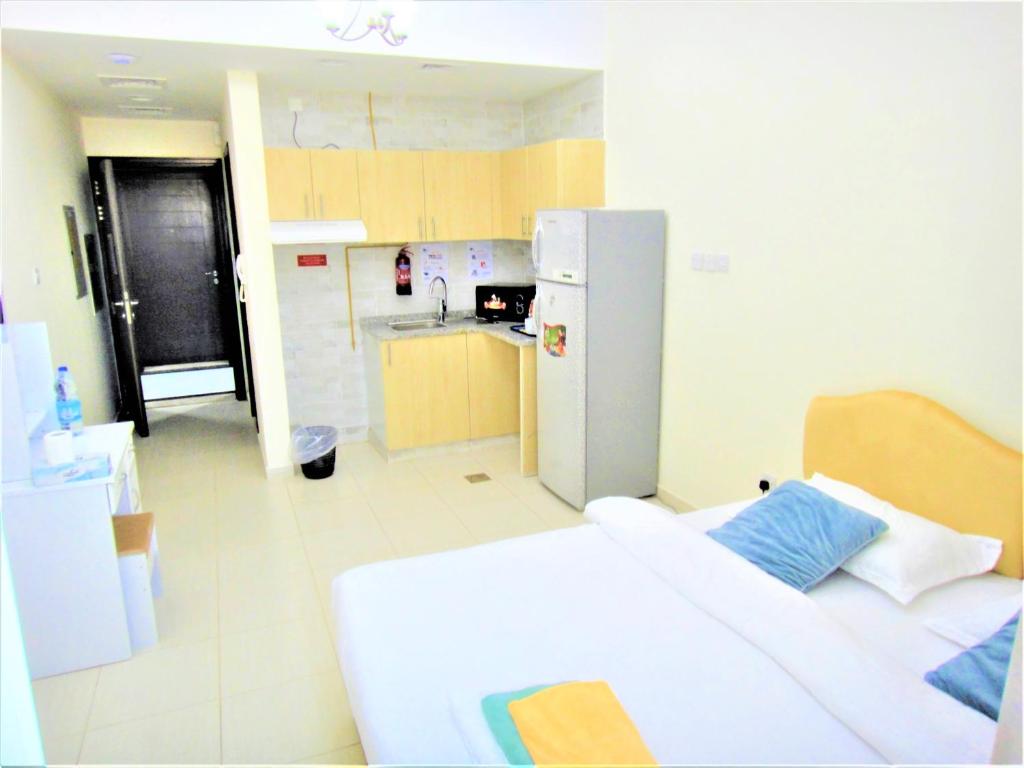 Kuchyň nebo kuchyňský kout v ubytování Abu Hail Star Residence - Home Stay