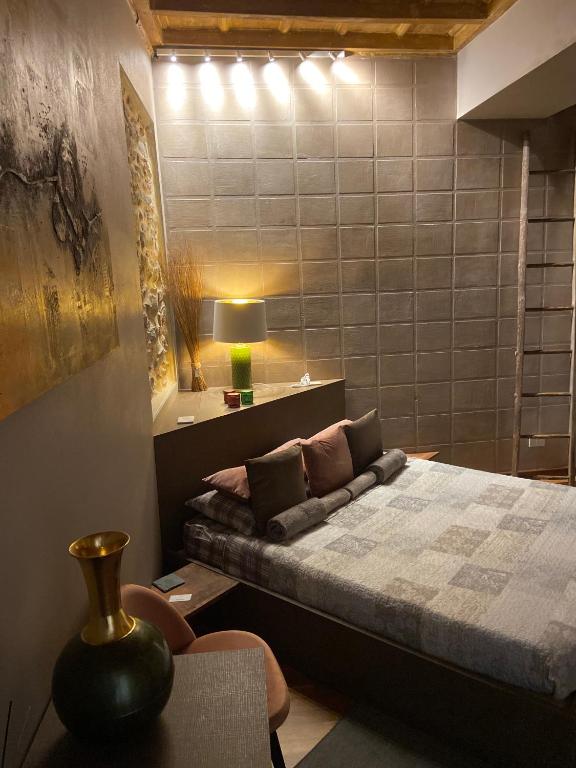 Postel nebo postele na pokoji v ubytování Epicuro guest house