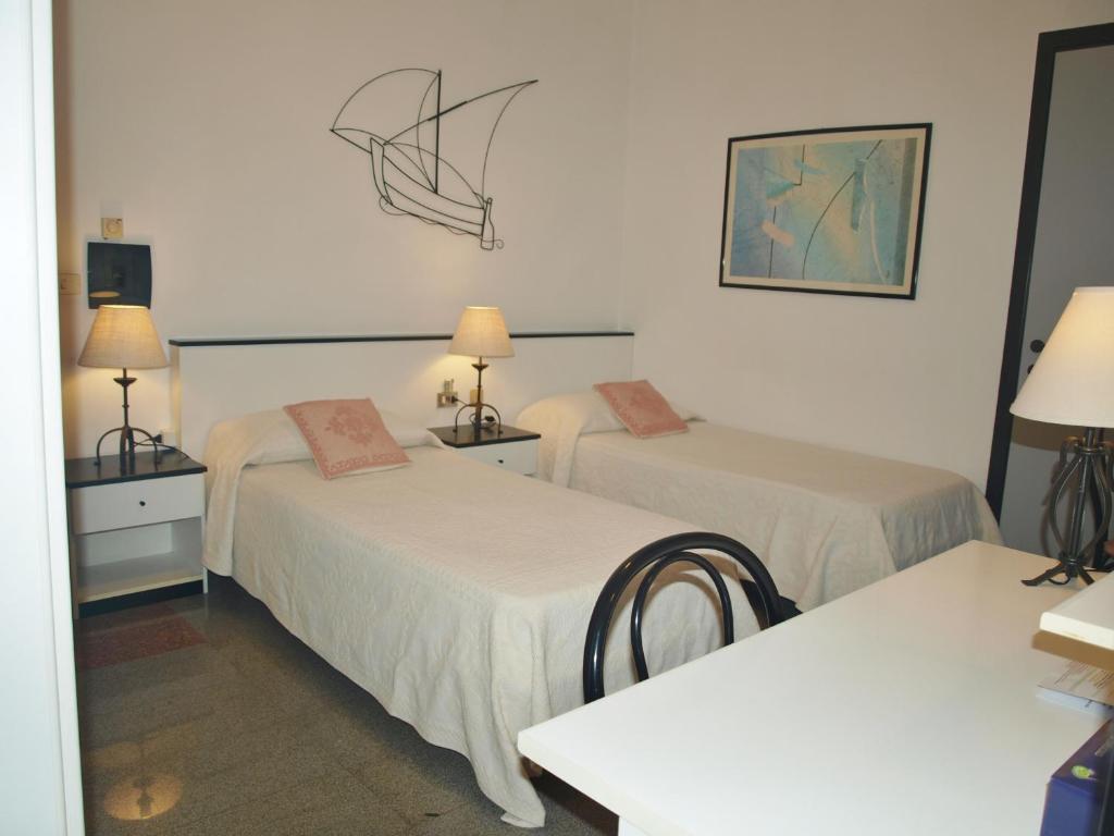 Posteľ alebo postele v izbe v ubytovaní Hotel La Conchiglia
