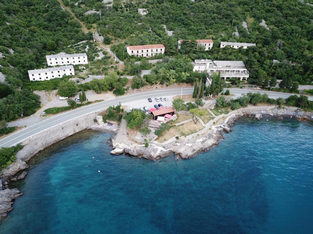 an aerial view of a resort next to the water at Delfin Apartments in Sveti Juraj