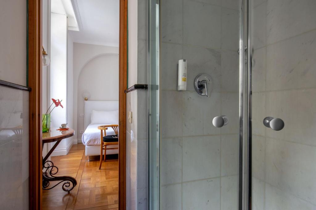 Postel nebo postele na pokoji v ubytování Hotel Emona Aquaeductus