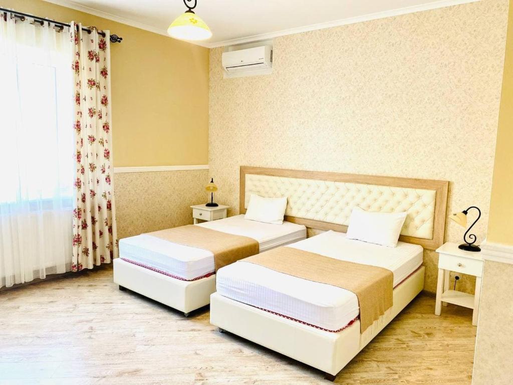 Postel nebo postele na pokoji v ubytování Green Hall Hotel