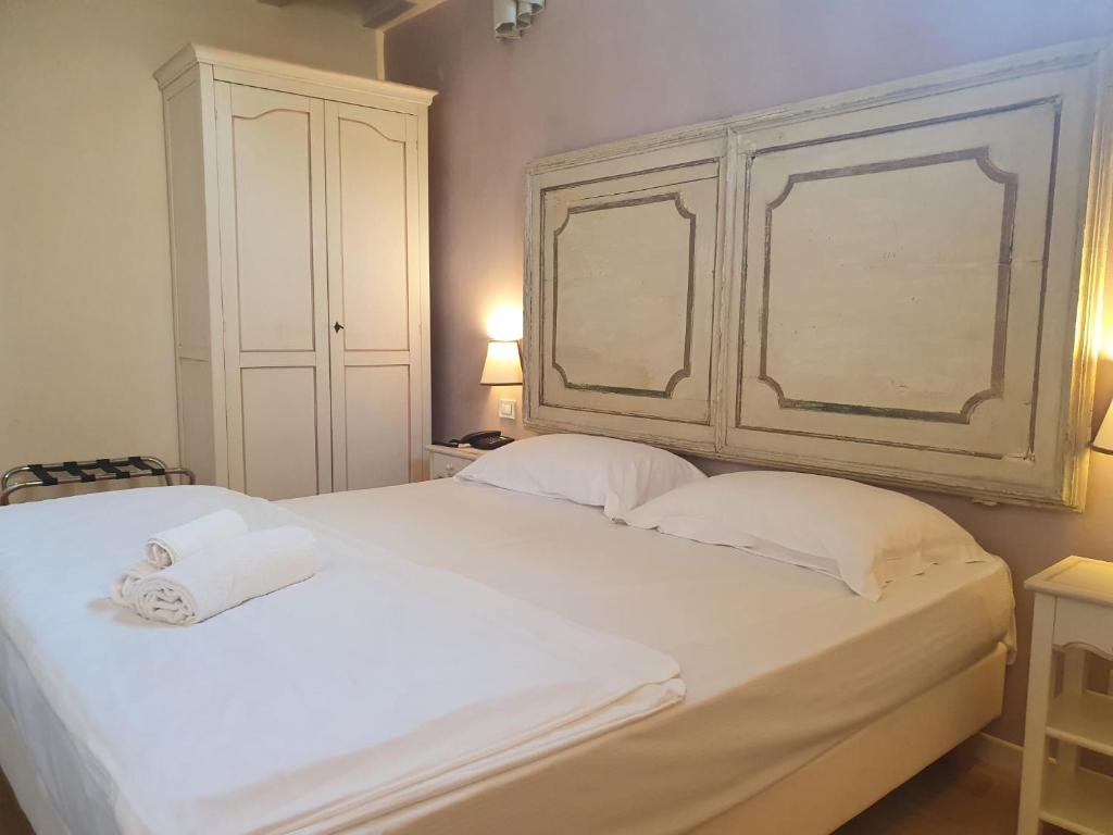 Postel nebo postele na pokoji v ubytování Hotel Villa Moron
