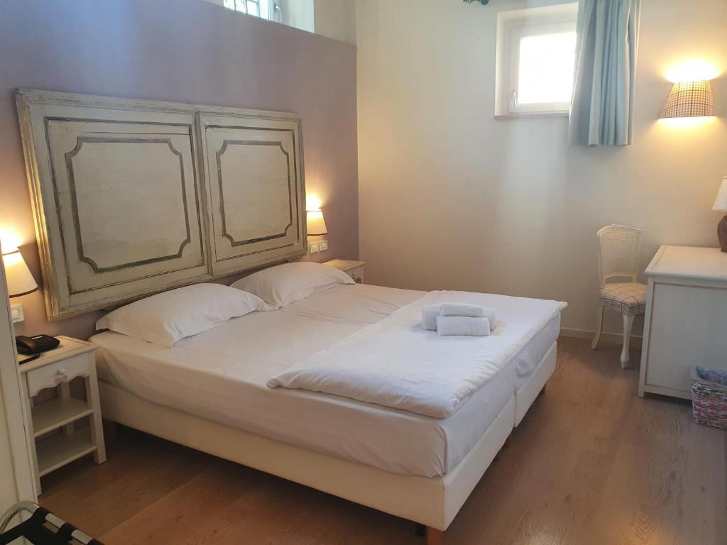 Postel nebo postele na pokoji v ubytování Hotel Villa Moron