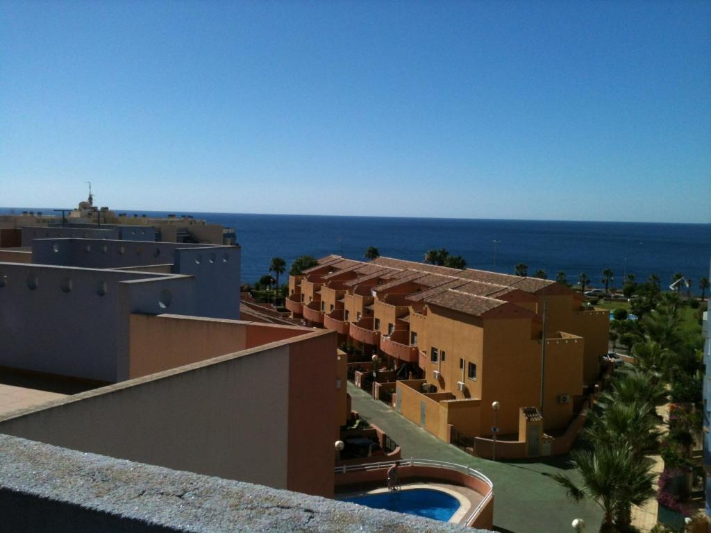 a view of the ocean from the balcony of a resort at Luxurious 2 bedroom apartment near Cabo Roig strip in Playas de Orihuela