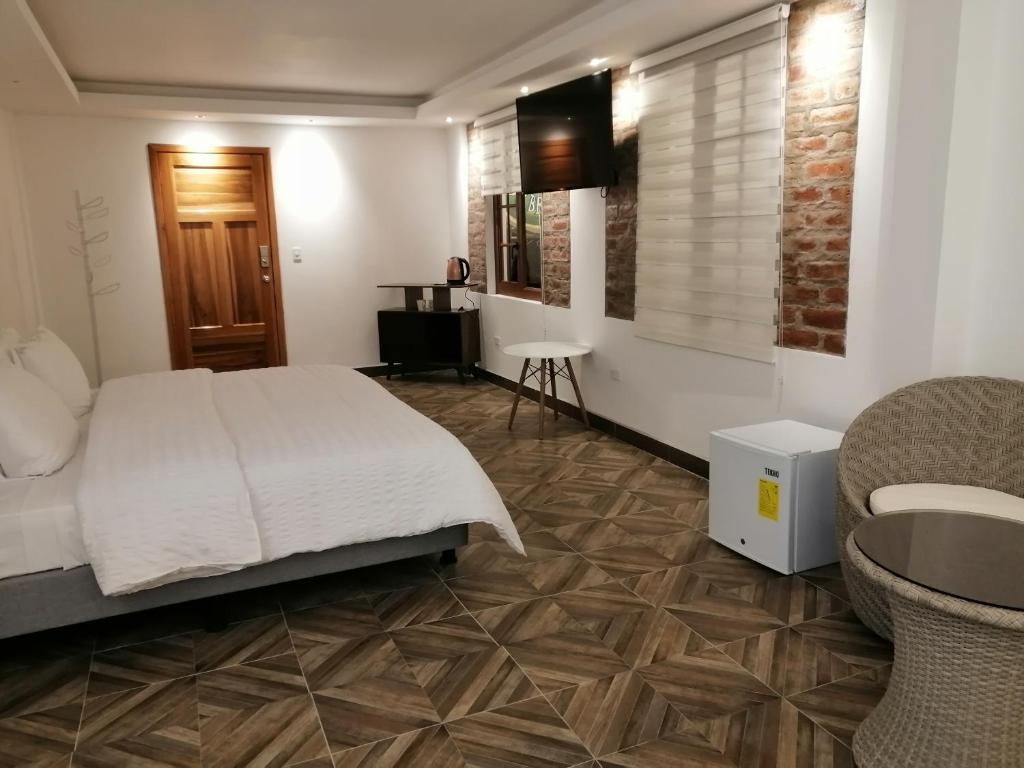 TV a/nebo společenská místnost v ubytování Hostal & Spa Casa Real