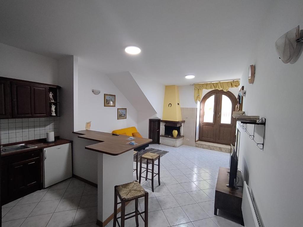 a kitchen with a counter and a stove in it at Le Casette di Franco & Anna in Assisi