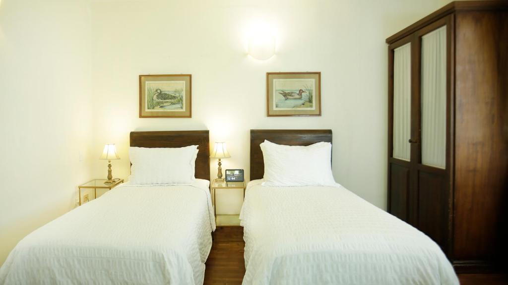 Postel nebo postele na pokoji v ubytování La Rabida Hotel Boutique
