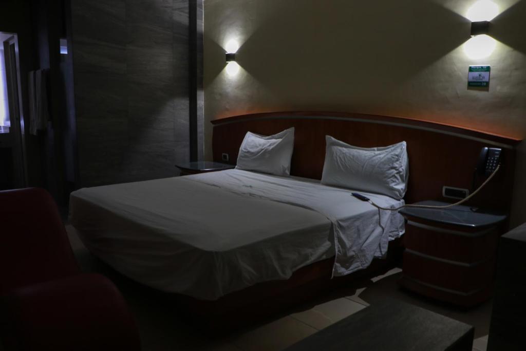 Postel nebo postele na pokoji v ubytování Autohotel Ilussion
