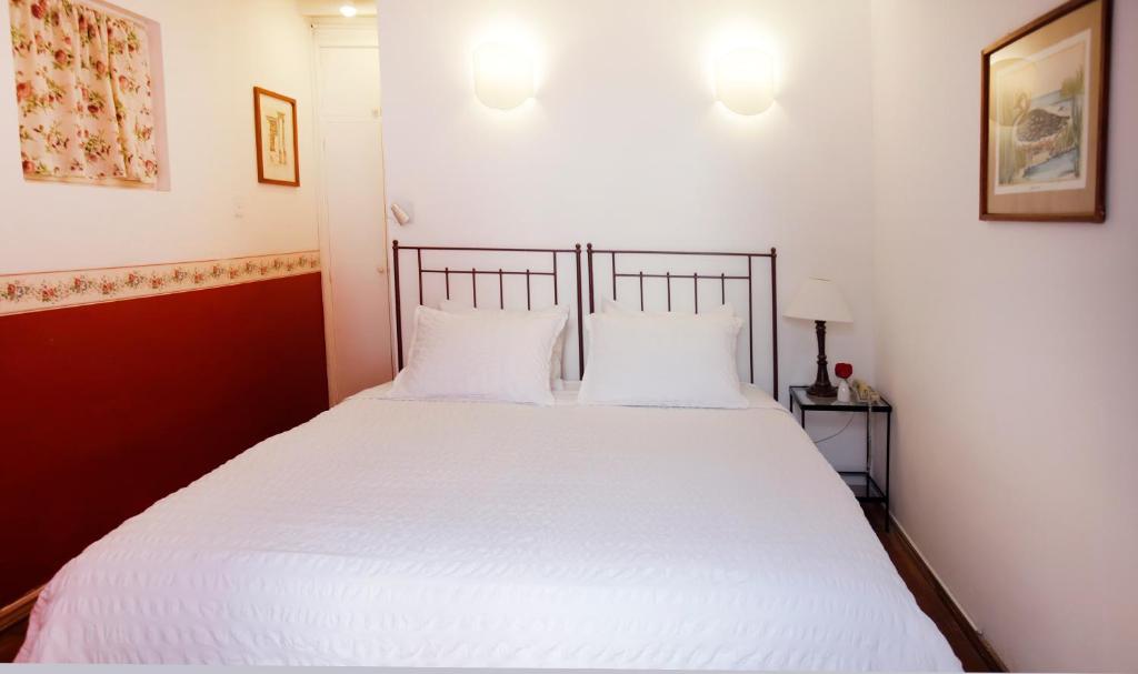 Postel nebo postele na pokoji v ubytování La Rabida Hotel Boutique