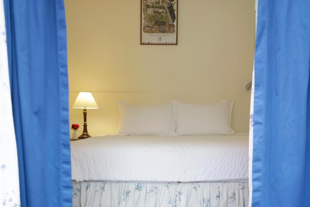 Postel nebo postele na pokoji v ubytování La Rabida Hotel Boutique