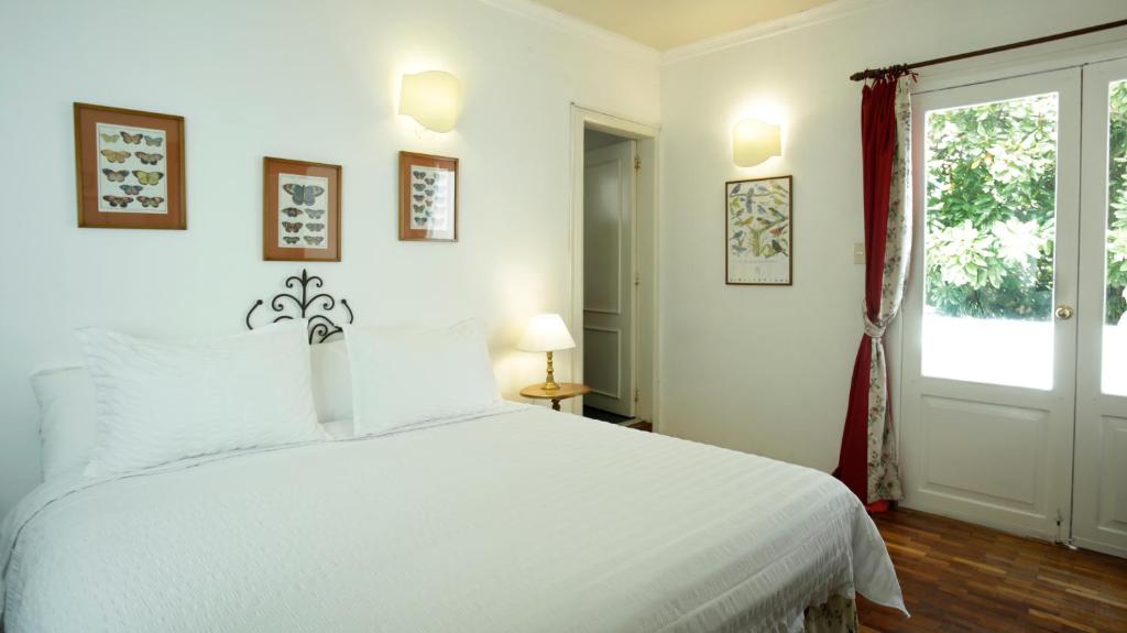 Postel nebo postele na pokoji v ubytování La Rabida Hotel Boutique