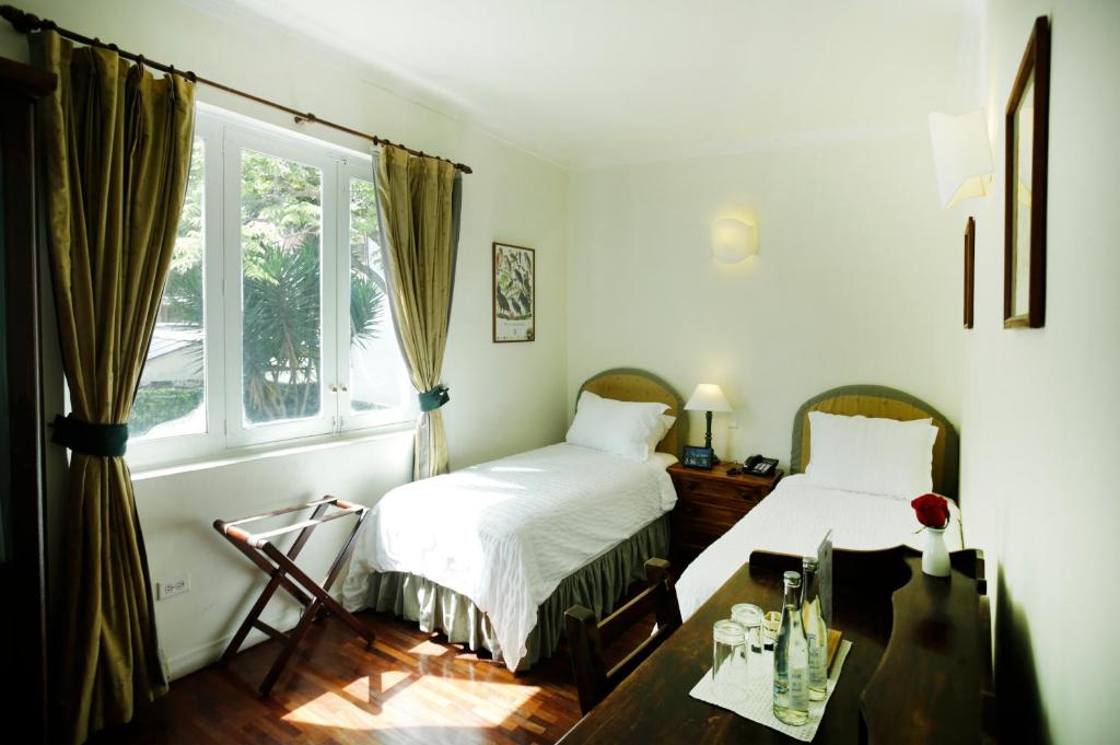 Postel nebo postele na pokoji v ubytování La Rabida Hotel Boutique