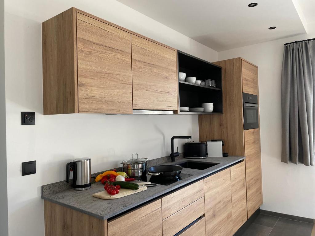 A kitchen or kitchenette at HAUSZEIT APPARTEMENTS