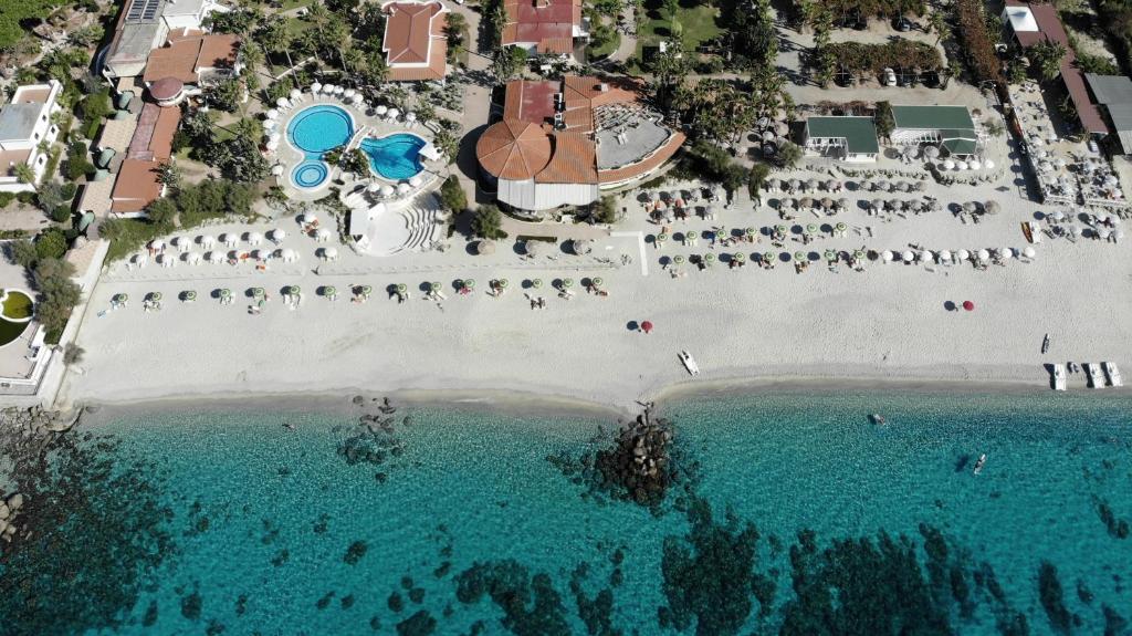 an aerial view of a beach with a pool of water at Villaggio Il Gabbiano in Capo Vaticano