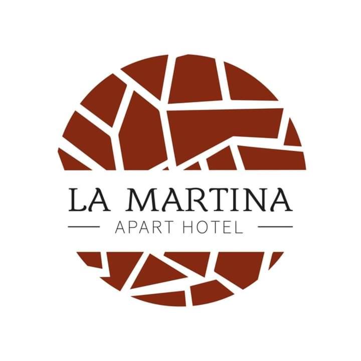 a logo for la marina apart hotel at LA MARTINA APART HOTEL in San Ignacio