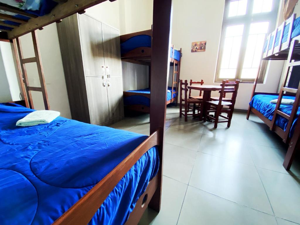 Postel nebo postele na pokoji v ubytování Lima House Hostel