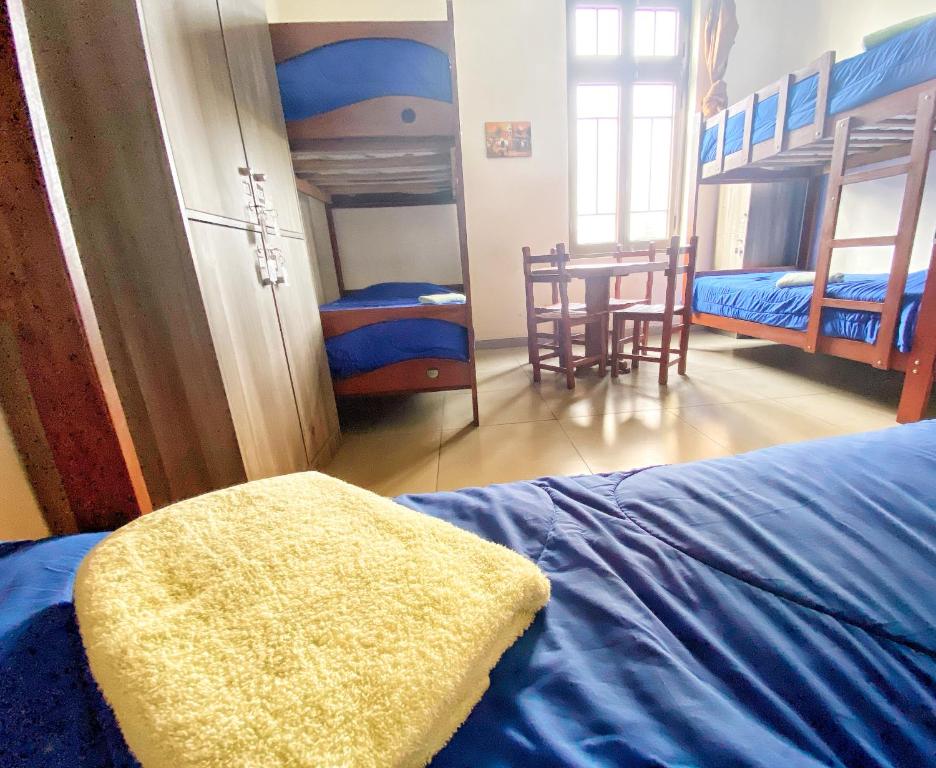 Postel nebo postele na pokoji v ubytování Lima House Hostel
