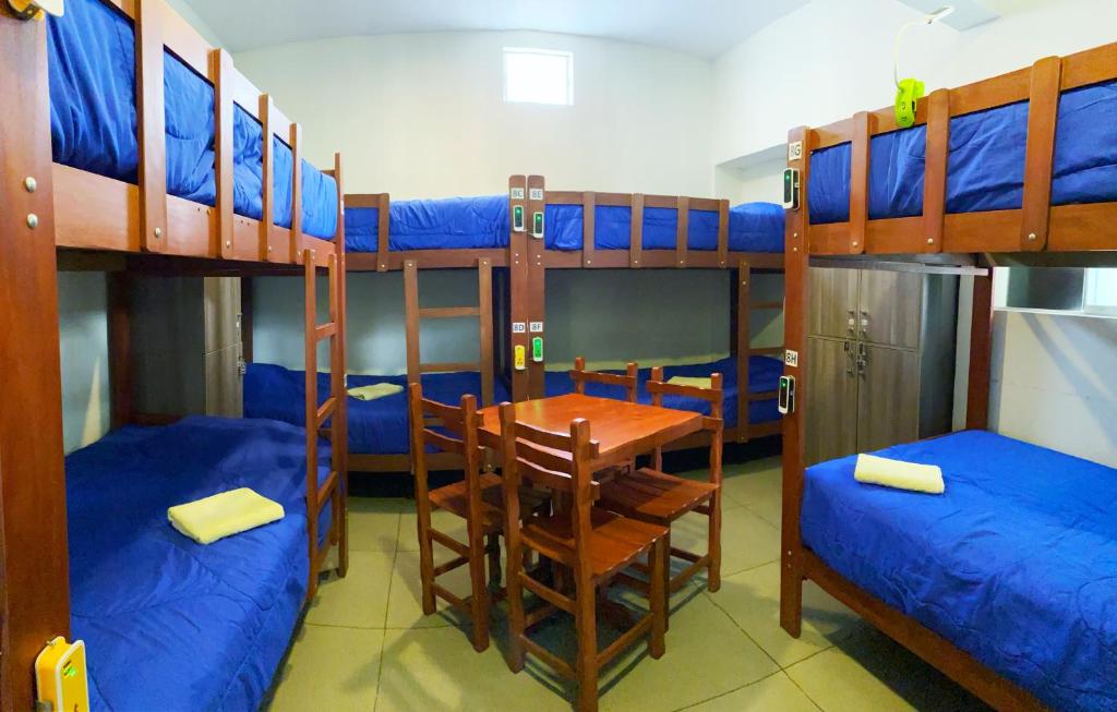 Postel nebo postele na pokoji v ubytování Lima House Hostel