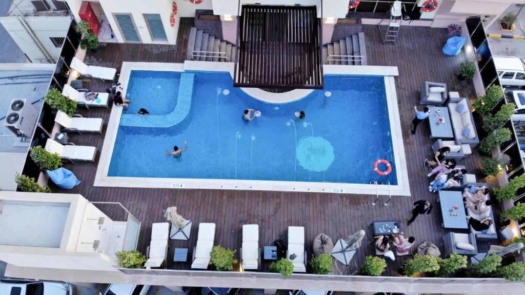 an overhead view of a swimming pool in a building at Royal View Hotel in Ras al Khaimah