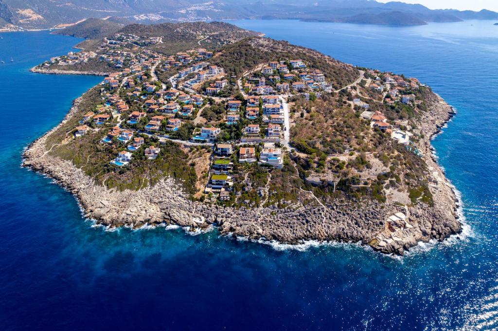 an aerial view of a small island in the ocean at La Kumsal Hotel in Kaş