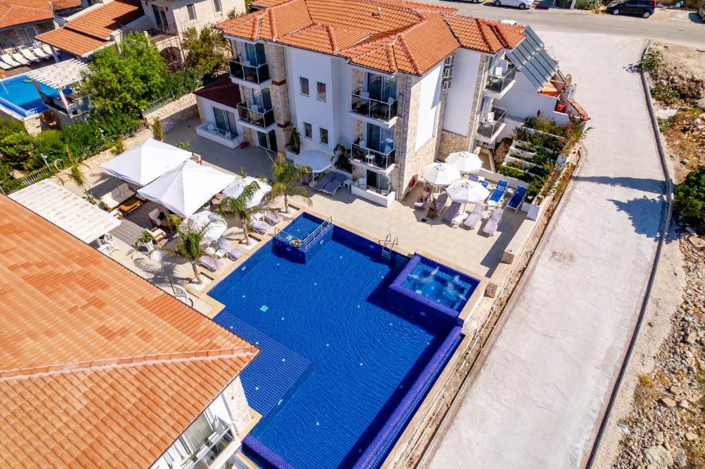 an overhead view of a house with a swimming pool at La Kumsal Hotel in Kaş