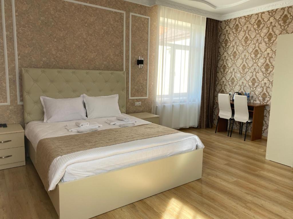 Postel nebo postele na pokoji v ubytování Hotel Sharl