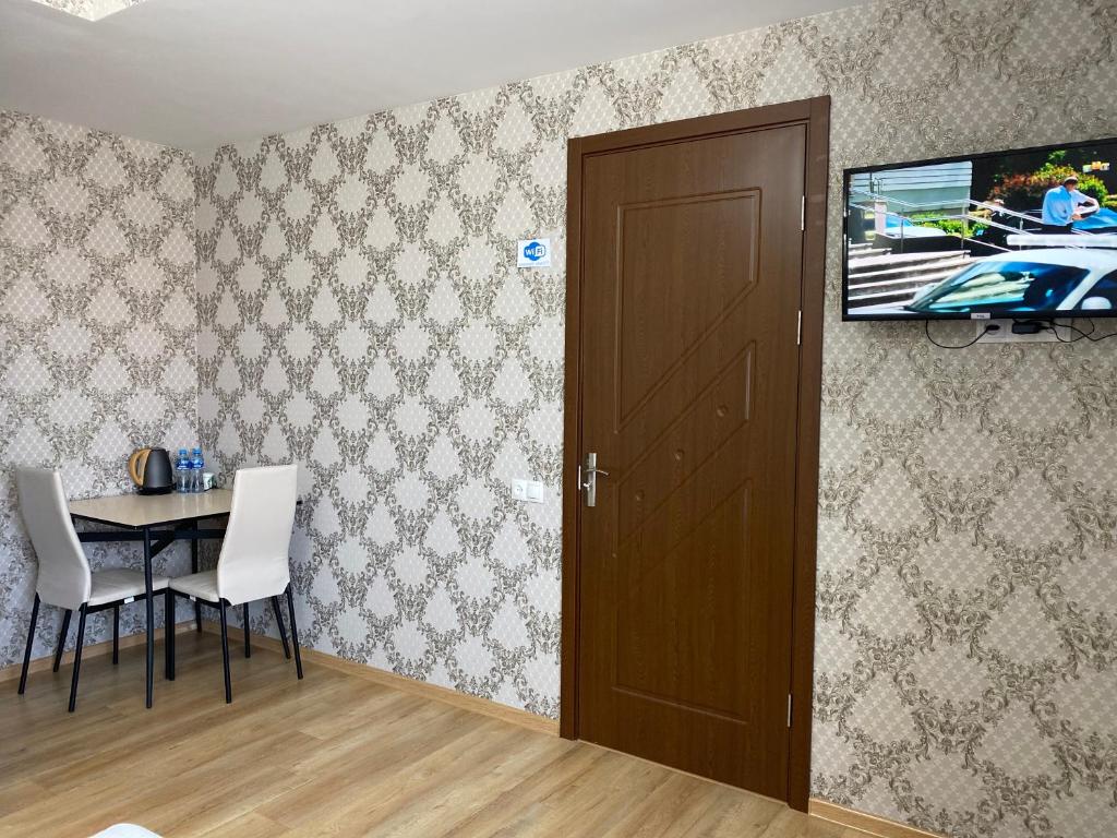 TV a/nebo společenská místnost v ubytování Hotel Sharl