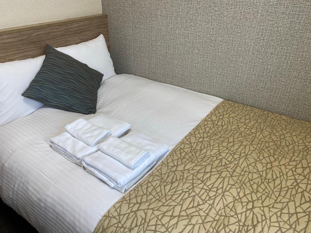 Voodi või voodid majutusasutuse Flexstay Inn Sakuragicho toas