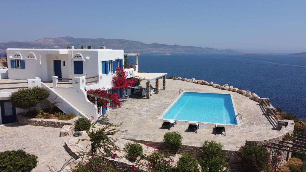 an external view of a villa with a swimming pool at The Aegean Horizon Villa in Grótta