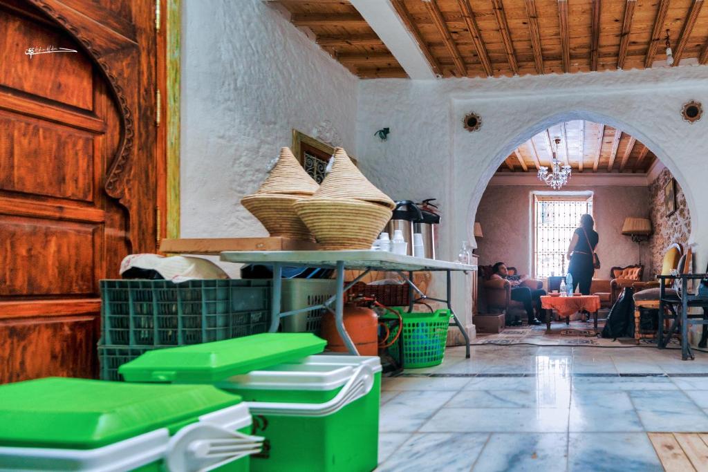 a room with a table with baskets on it at RIAD LA SANTA in Chefchaouen
