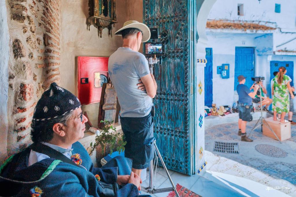a man standing in front of a mirror at RIAD LA SANTA in Chefchaouen