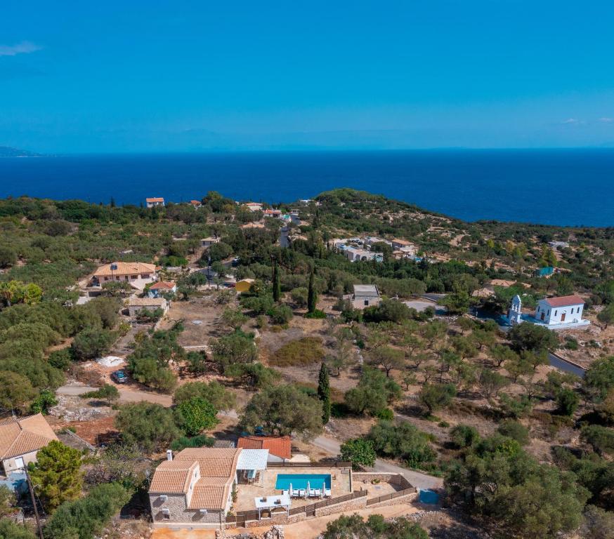 an aerial view of a village on a hill next to the ocean at Villa Daniela in Koríthion