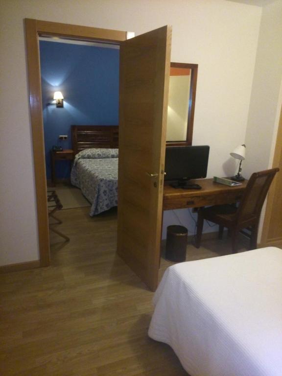Una cama o camas en una habitaci&oacute;n de Hotel Rural Casa de Campo