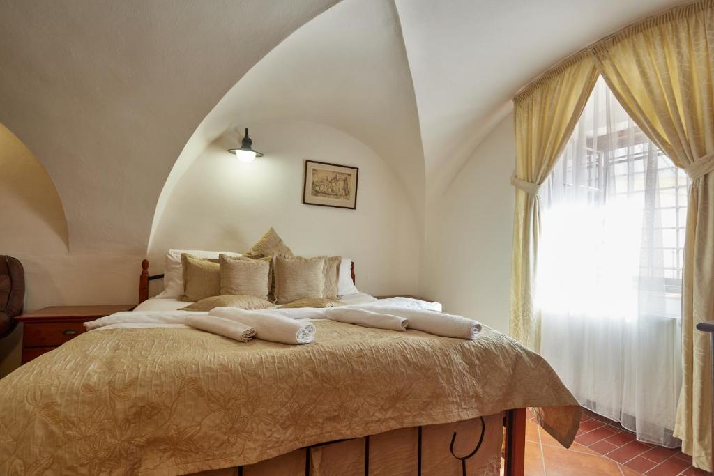 Postel nebo postele na pokoji v ubytování Vivaldi Apartments