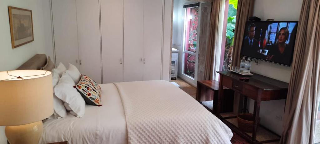 Postel nebo postele na pokoji v ubytování Candelaria House Boutique