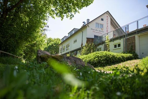 a building in the middle of a field of grass at Haus des Sports in Bad Kreuznach