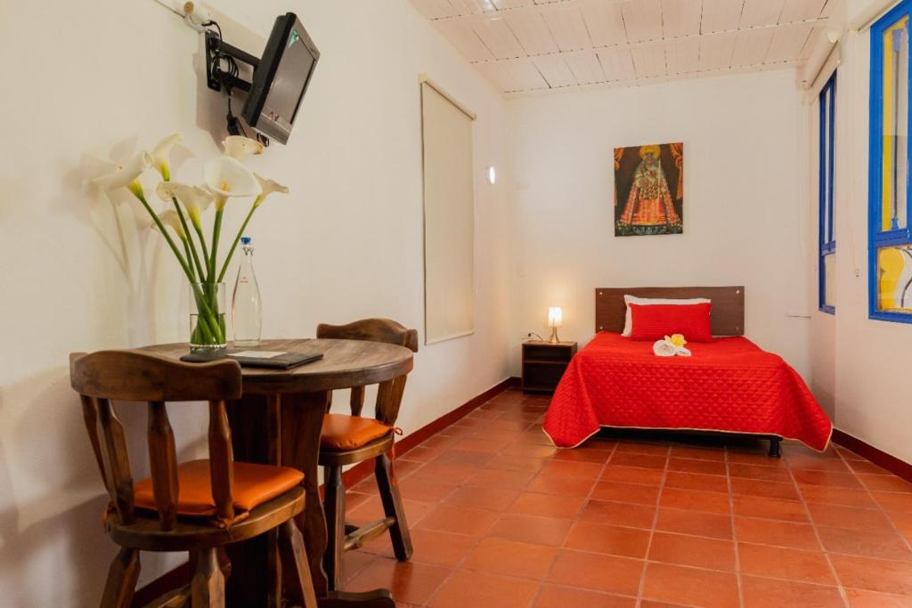 Postel nebo postele na pokoji v ubytování hotel villa claudia