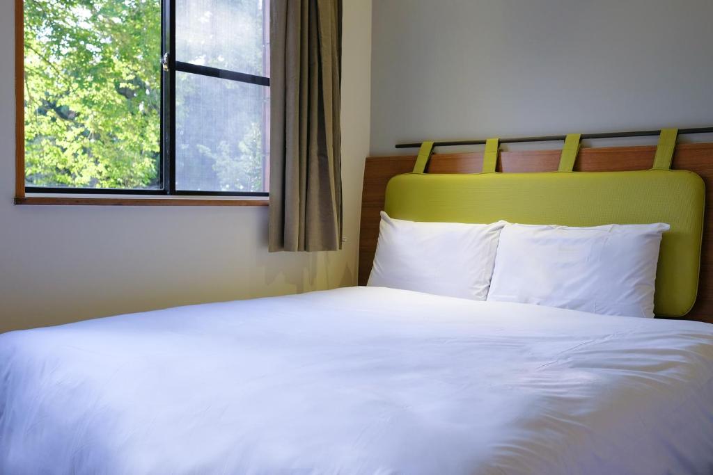 Postel nebo postele na pokoji v ubytování Howard Resort Xitou