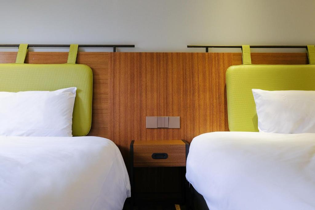 Postel nebo postele na pokoji v ubytování Howard Resort Xitou