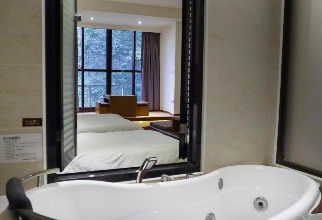 Postel nebo postele na pokoji v ubytování Howard Resort Xitou