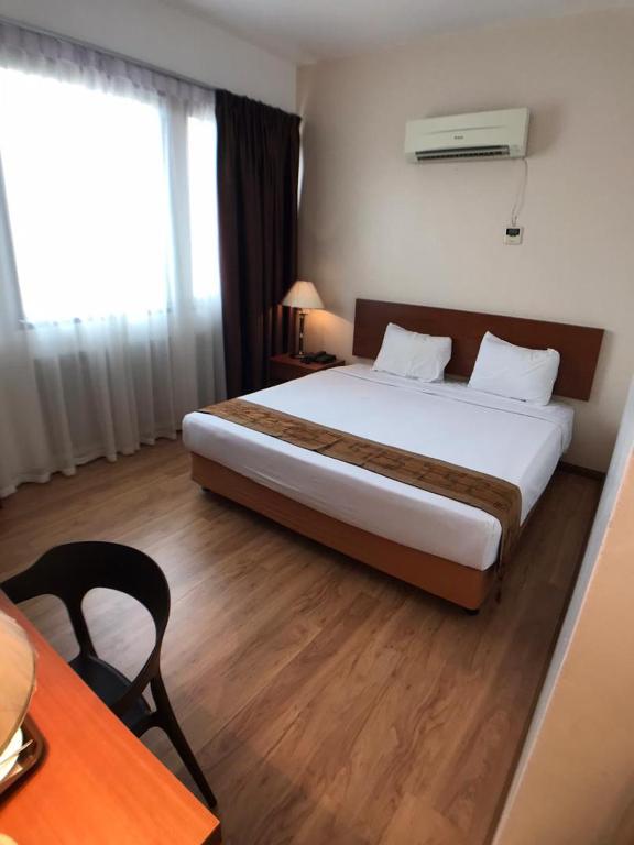 Postel nebo postele na pokoji v ubytování Kawan Hotel