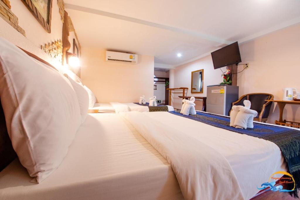 Postel nebo postele na pokoji v ubytování Naiyang Discovery Beach Resort SHA