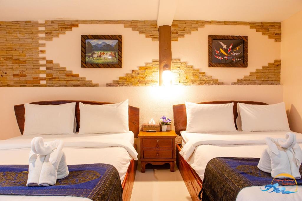 Postel nebo postele na pokoji v ubytování Naiyang Discovery Beach Resort SHA