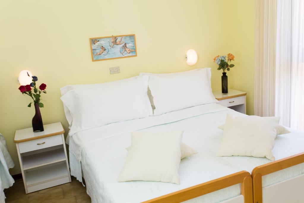 Postel nebo postele na pokoji v ubytování Hotel Valentino